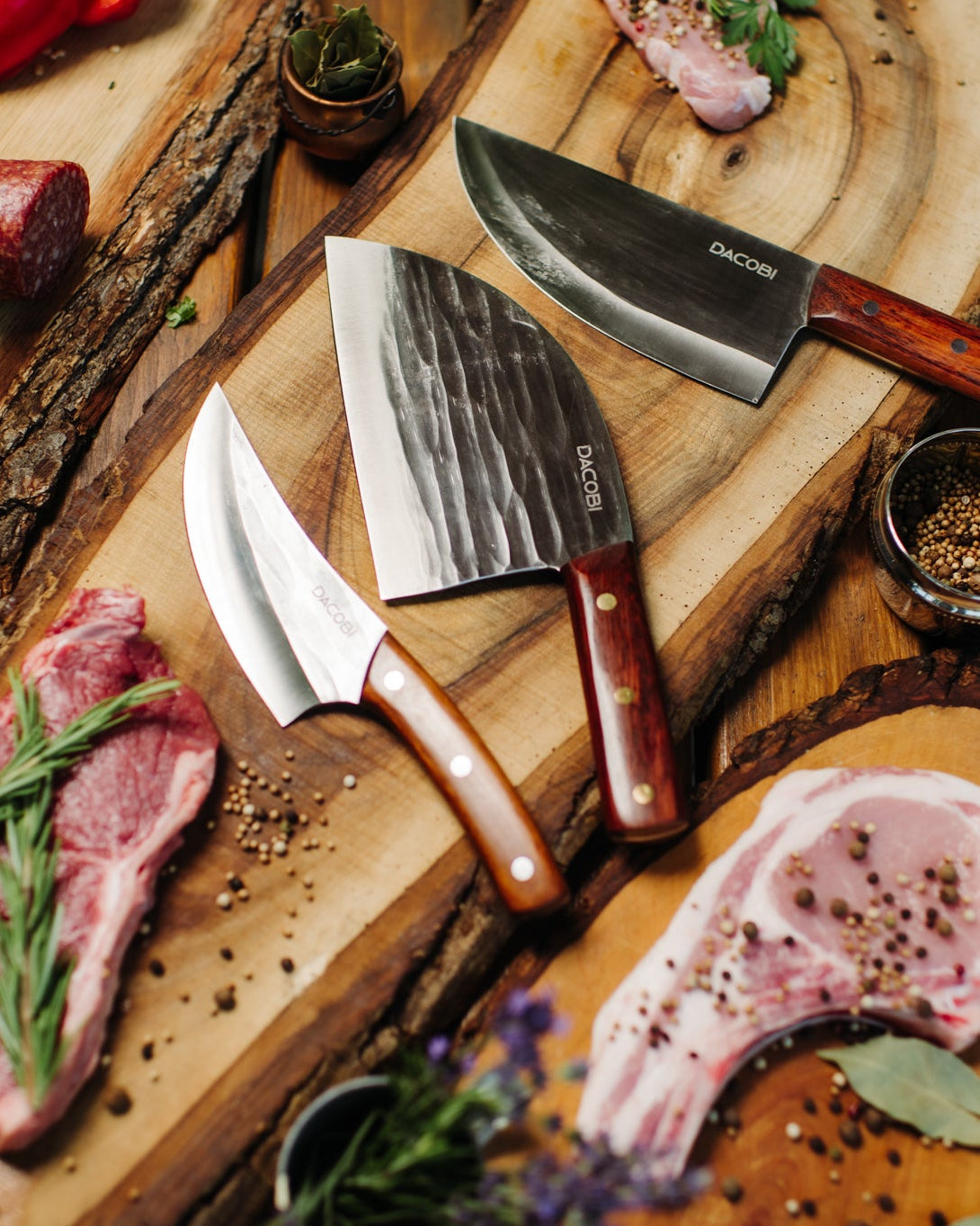 Gift for your husband, DACOBI knives and cleavers on a wooden board next to fresh meat