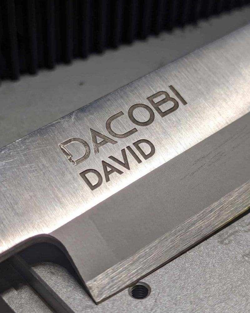 Personalised gifts for men, laser engraving on a blade in the DACOBI workshop