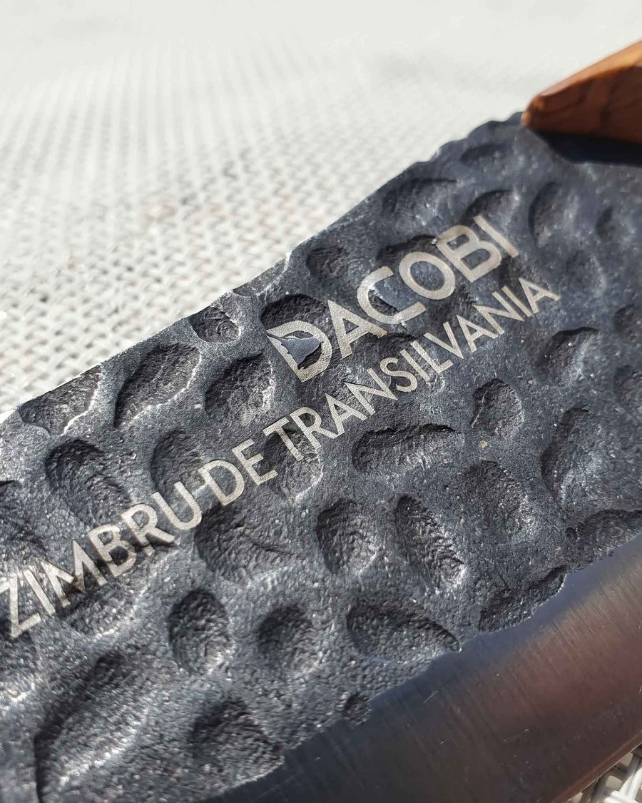 Black DACOBI blade with the words ZIMBRU DE TRANSILVANIA laser-engraved