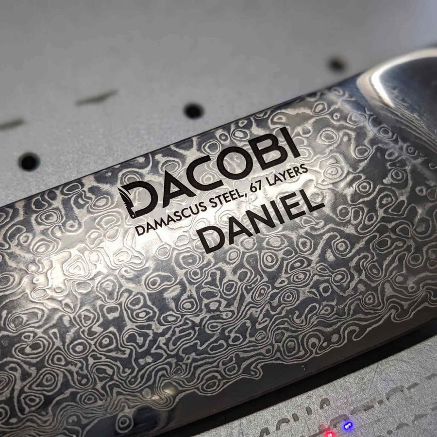 DACOBI Damascus steel knife with the name DANIEL laser-engraved on the blade