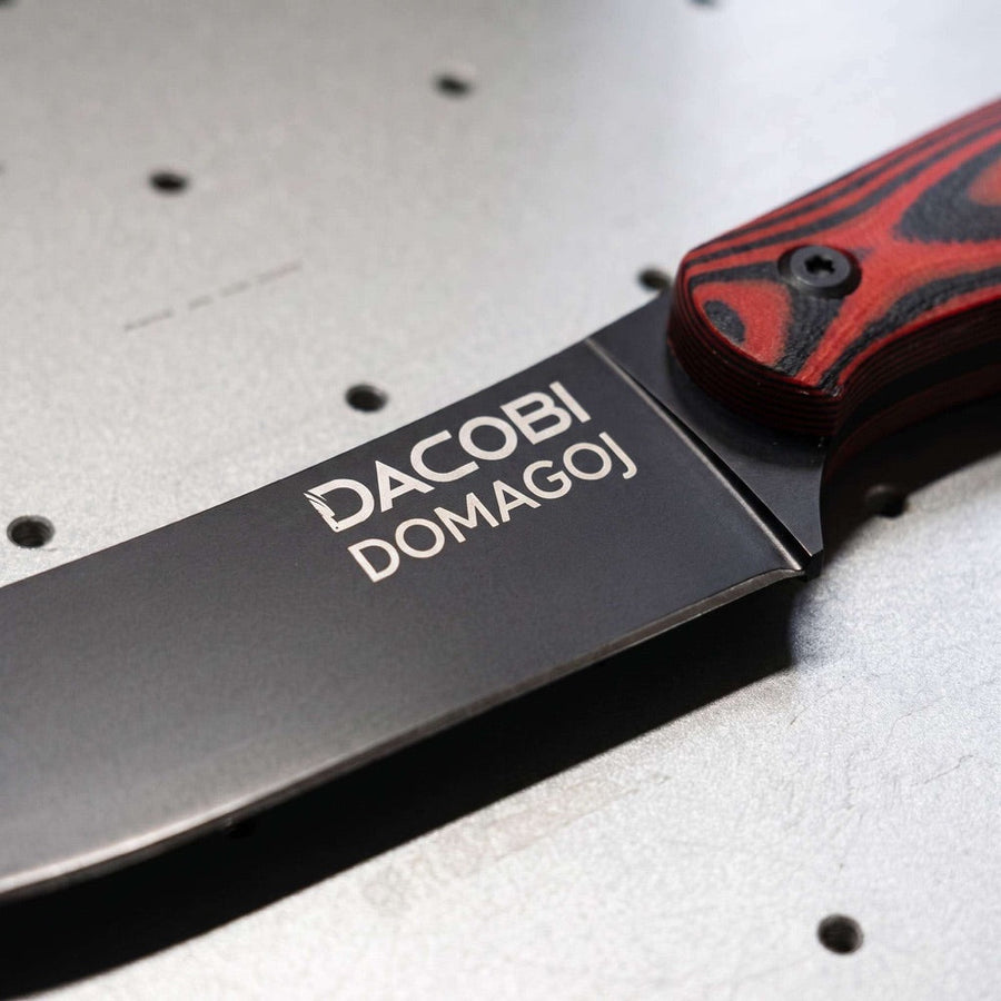 Black DACOBI blade with the name DOMAGOJ laser-engraved