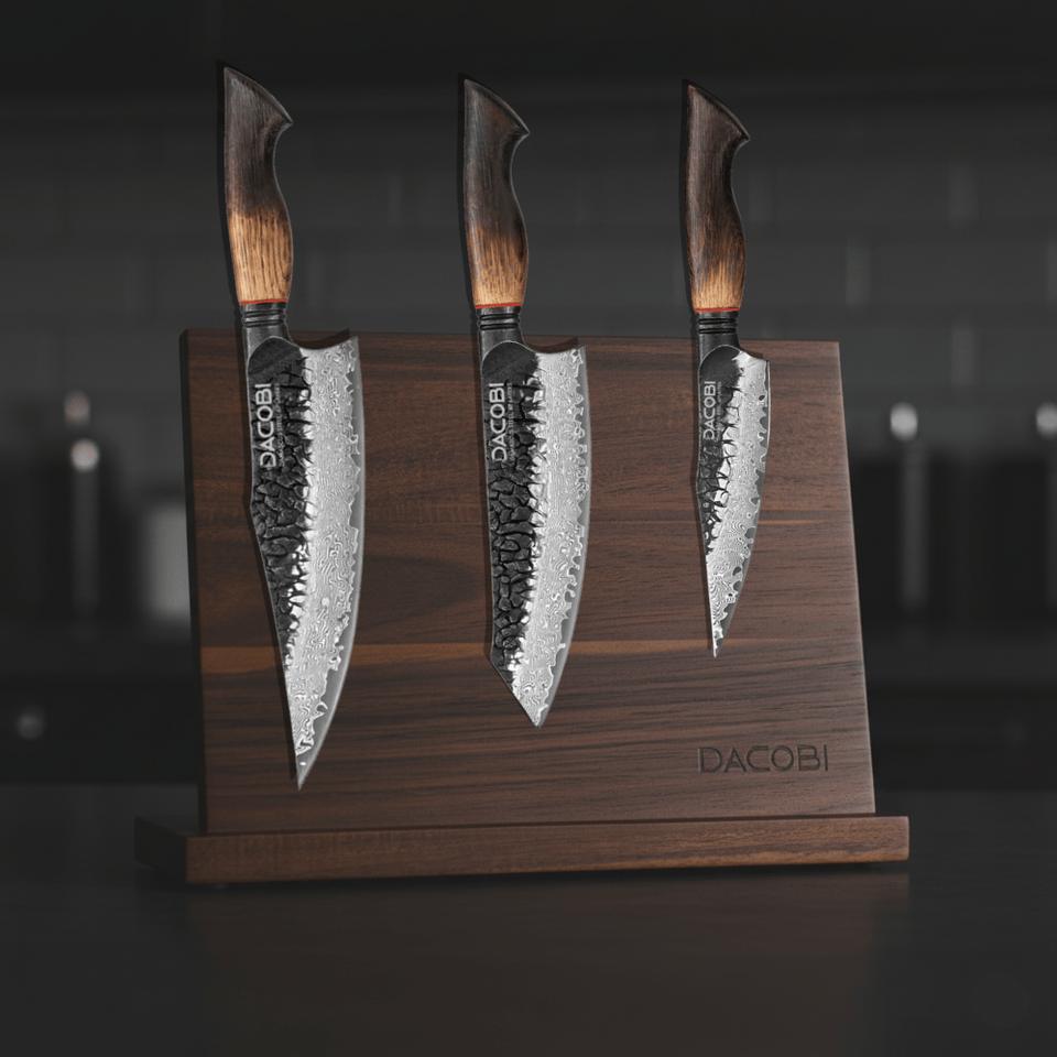 Three DACOBI knives on a magnetic wooden knife stand